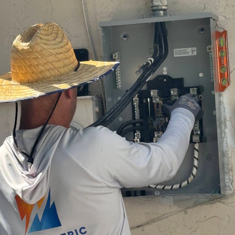 Mark McLaughlin of MTM Electric working inside an open meter main at a customer home in Broward County